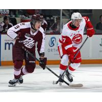 Peterborough Petes defenseman Blake Gowan (left) vs. the Soo Greyhounds