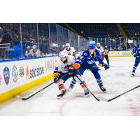 Bridgeport Islanders' Matthew Maggio versus Syracuse Crunch's Kale Kessy