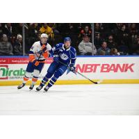 Bridgeport Islanders' Matias Rajaniemi and Syracuse Crunch's Joël Teasdale in action